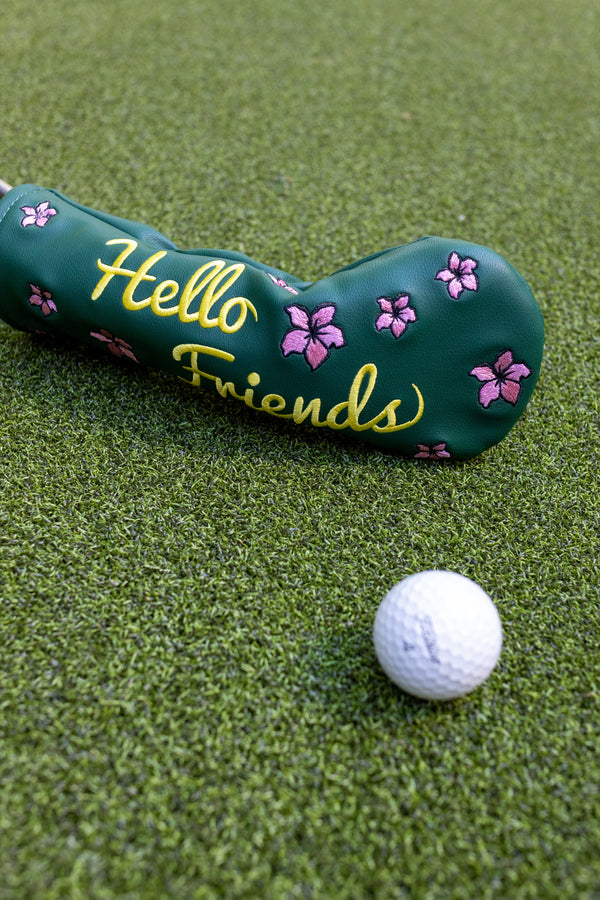 "Hello Friends" hybrid headcover by Tall Pines Golf, on the grass